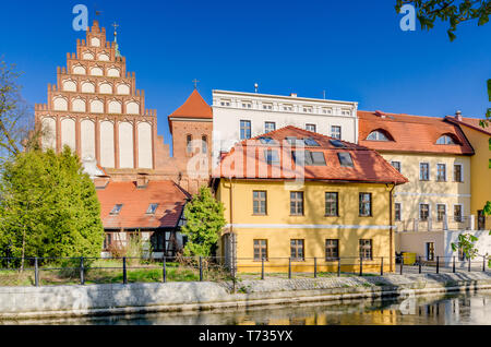Bydgoszcz, Kuyavian-pomeranian province, Poland. St. Martin and St. Nicholas Cathedral with surrounding buildings on the Mlynowka riverbank. Stock Photo
