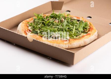 Pizza in a cardboard box close up Stock Photo