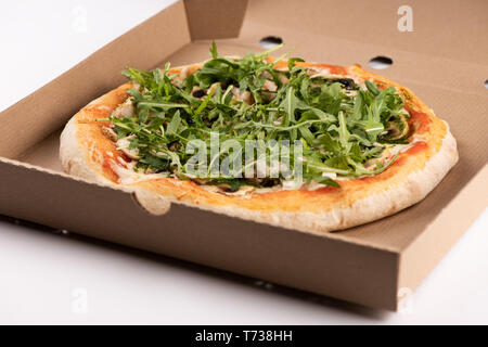 Pizza in a cardboard box close up Stock Photo