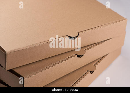Empty pizza box isolated on white background close up Stock Photo