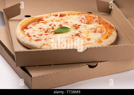 Pizza in a cardboard box close up Stock Photo