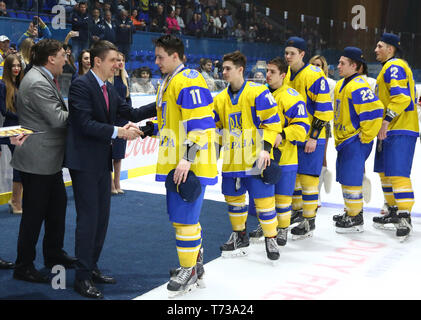 KYIV, UKRAINE - APRIL 20, 2018: Team of Ukraine, the winner of the IIHF 2018 Ice Hockey U18 World Championship Div 1B. Medal ceremony at Palace of Spo Stock Photo