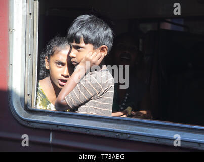 looking out traveling by train through the hill country in sri lanka Stock Photo