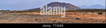 panorama picture of a red mountain called montana roja in Playa Blanca, Lanzarote Stock Photo