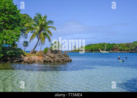 Tourists enjoying the water off the coast of West End Village; Roatan, Bay Islands Department, Honduras Stock Photo