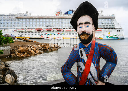 Cruise ship at port and statue at the waterfront, Community of Gravel Bay, Coxen Hole; Roatan, Bay Islands Department, Honduras Stock Photo