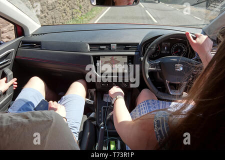 In-car shot of young couple driving Stock Photo