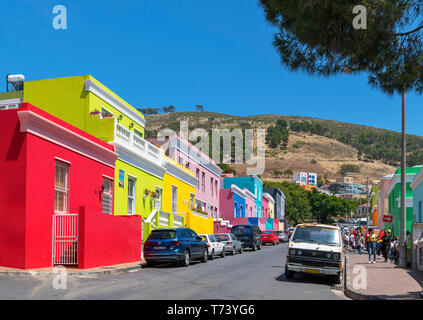 Colourful heritage houses on Wale Street with Signal Hill behind, Bo-Kaap district, Cape Town, Western Cape, South Africa Stock Photo