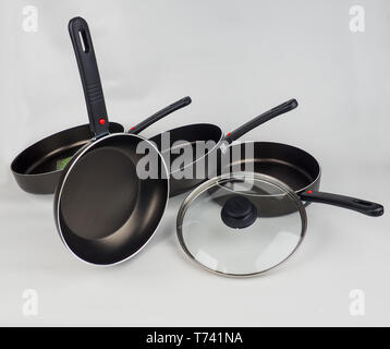Cooking Pot and Frying Pans on White Background. Stock Photo