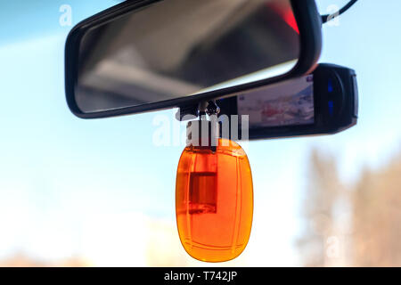 Car video recorder installed on front window, close up photo Stock Photo