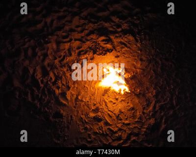 Bonfire on sand above top view at night time Stock Photo