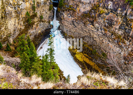 The spectacular ice and snow cone in winter at the bottom of Spahats Falls on Spahats Creek in Wells Gray Provincial Park near Clearwater, BC, Canada