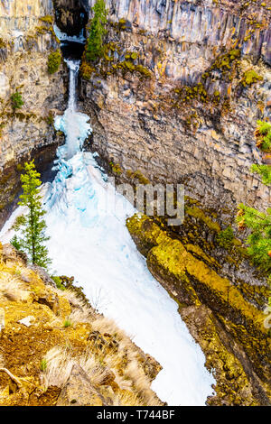 The spectacular ice and snow cone in winter at the bottom of Spahats Falls on Spahats Creek in Wells Gray Provincial Park near Clearwater, BC, Canada