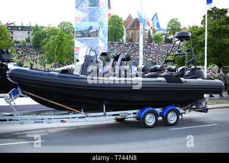 Poland: Tanks, ATVs, SUVs and artillery of Polish Army roll at military parade during celebrations of the constitution. Stock Photo