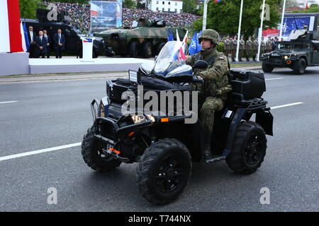 Poland: Tanks, ATVs, SUVs and artillery of Polish Army roll at military parade during celebrations of the constitution. Stock Photo