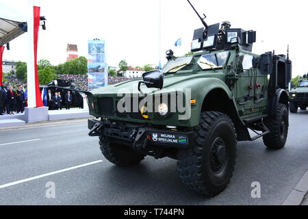 Poland: Tanks, ATVs, SUVs and artillery of Polish Army roll at military parade during celebrations of the constitution. Stock Photo