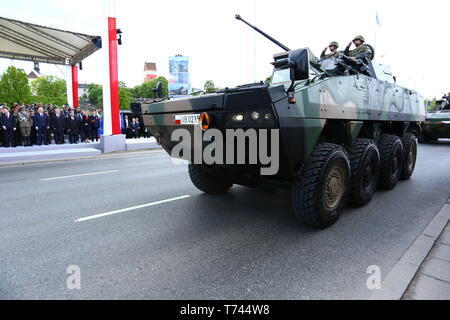 Poland: Tanks, ATVs, SUVs and artillery of Polish Army roll at military parade during celebrations of the constitution. Stock Photo