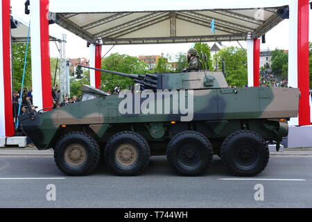 Poland: Tanks, ATVs, SUVs and artillery of Polish Army roll at military parade during celebrations of the constitution. Stock Photo