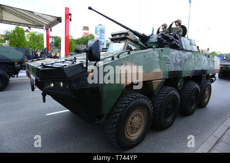 Poland: Tanks, ATVs, SUVs and artillery of Polish Army roll at military parade during celebrations of the constitution. Stock Photo