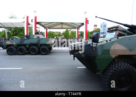 Poland: Tanks, ATVs, SUVs and artillery of Polish Army roll at military parade during celebrations of the constitution. Stock Photo