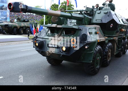 Poland: Tanks, ATVs, SUVs and artillery of Polish Army roll at military parade during celebrations of the constitution. Stock Photo