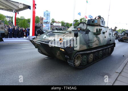 Poland: Tanks, ATVs, SUVs and artillery of Polish Army roll at military parade during celebrations of the constitution. Stock Photo