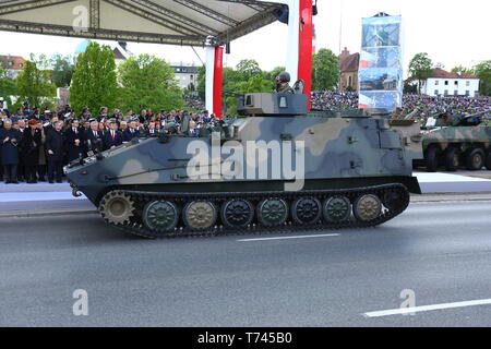 Poland: Tanks, ATVs, SUVs and artillery of Polish Army roll at military parade during celebrations of the constitution. Stock Photo