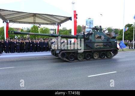 Poland: Tanks, ATVs, SUVs and artillery of Polish Army roll at military parade during celebrations of the constitution. Stock Photo