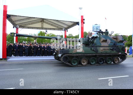 Poland: Tanks, ATVs, SUVs and artillery of Polish Army roll at military parade during celebrations of the constitution. Stock Photo