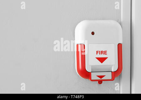 Manual fire alarm pull station indoors Stock Photo