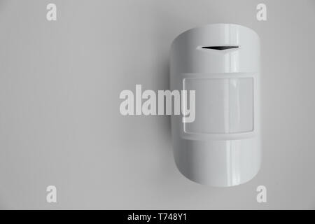 Modern motion sensor indoors Stock Photo
