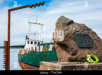 A weathered fishing boat moored at the waterfront; Arranmore Island, County Donegal, Ireland Stock Photo