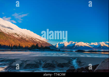 The out-going tide in Turnagain Arm on a sunny, winter day; Alaska, United States fo America Stock Photo