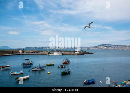 Boats in a small port overlooking Naples in the Gulf of Naples; Naples, Italy Stock Photo