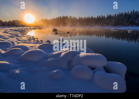 Winter afternoon along the shoreline of Mendenhall River, Tongass National Forest; Juneau, Alaska, United States of America Stock Photo