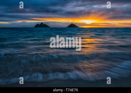 Sunrise over Lanikai Beach; Oahu, Hawaii, United States of America Stock Photo