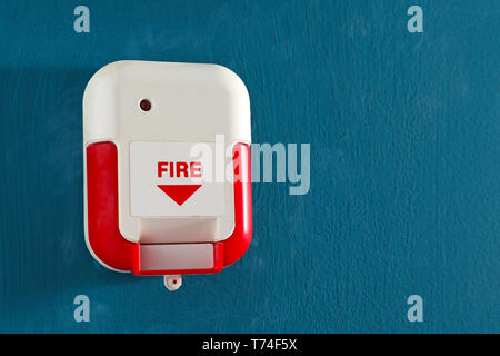 Manual fire alarm pull station on color wall