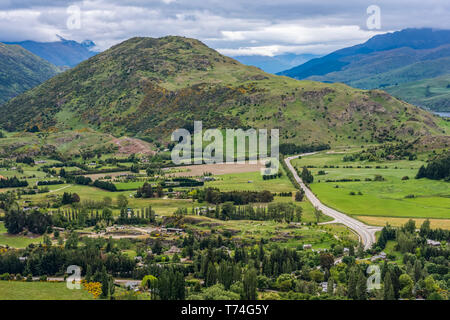 Beautiful Queenstown viewed from the Arrow Junction Lookout Point; Queenstown, South Island, New Zealand Stock Photo