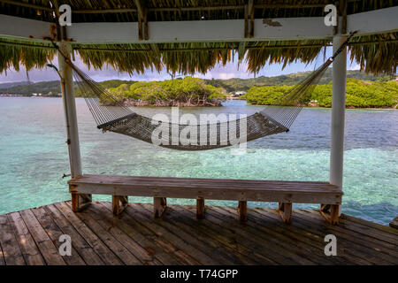 Hammock on a dock; Bay Islands Department, Honduras Stock Photo