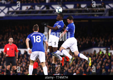 LIVERPOOL, ENGLAND 3rd May Everton's Kurt Zouma (Centre) and Everton's Michael Keane (Right) jump for the ball during the Premier League match between Everton and Burnley at Goodison Park, Liverpool on Friday 3rd May 2019. (Credit: Tim Markland | MI News)  Editorial use only, license required for commercial use. No use in betting, games or a single club/league/player publications. Photograph may only be used for newspaper and/or magazine editorial purposes. Stock Photo