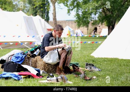 Smederevo. 2nd May, 2019. A competitor cleans his armor after a fight at the opening day of the 10th World National HMB (Historic Medieval Battle) Championship in Smederevo, Serbia on May 2, 2019. Fighters from 40 countries gathered in the Serbian city of Smederevo for an unusual international tournament that recreates historic battle techniques-the World National HMB Championship. The Chinese team is made up of 27 members, and it is China's third appearance at the event. Credit: Shi Zhongyu/Xinhua/Alamy Live News Stock Photo