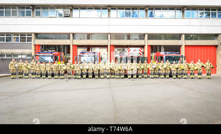 Paddington, London, UK. 04th May, 2019. Fire Fighters from the Green Watch, with watch manager Graham Danbury, together with firefighters with from Kensington, Kentish Town and Park Royal who have joined for a drill, line up outside Paddington Fire Station and their engines for Firefighters Memorial Day, remembering fire fighers and colleagues who were injured or lost their lives on duty. The day is celebrated in many countries and also known as International Firefighters Day in some regions. Credit: Imageplotter/Alamy Live News Stock Photo