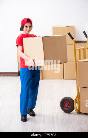 Young female professional mover doing home relocation Stock Photo