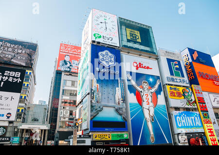 Osaka, Japan - April 3, 2019 : Dotonbori Glico running man sign and shopping street Stock Photo