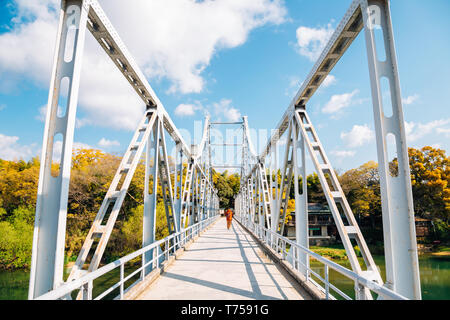 Old bridge on Asahi river near Okayama Castle in Japan Stock Photo