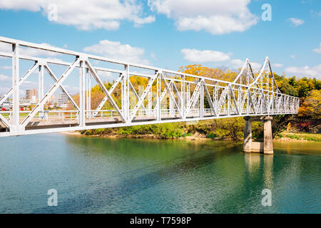 Old bridge on Asahi river near Okayama Castle in Japan Stock Photo