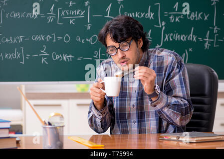 Funny male math teacher in the classroom Stock Photo