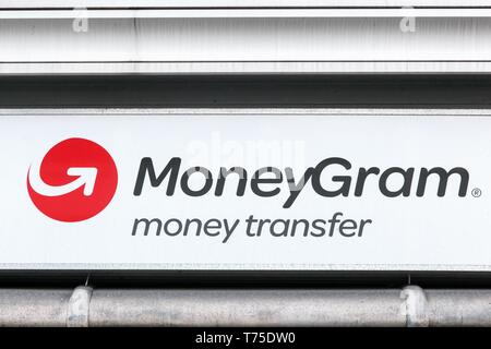 Copenhagen, Denmark - April 2, 2019: MoneyGram logo on a wall. MoneyGram International Inc. is a money transfer company based in the United States Stock Photo