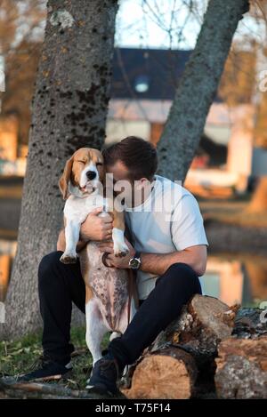 Man with favorit beagle dog pet handsome portrait Stock Photo