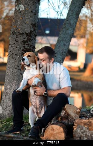 Man with favorit beagle dog pet handsome portrait Stock Photo